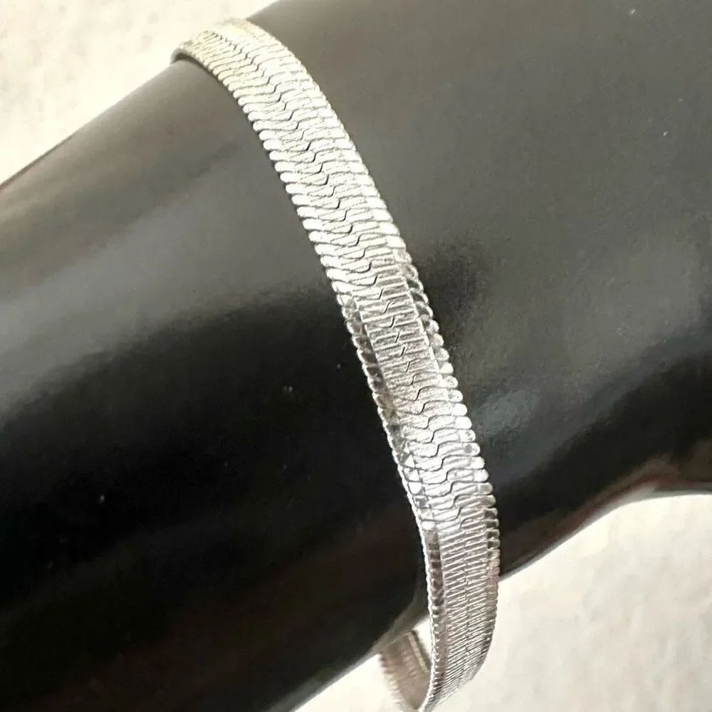 Silver tone herringbone chain bracelet